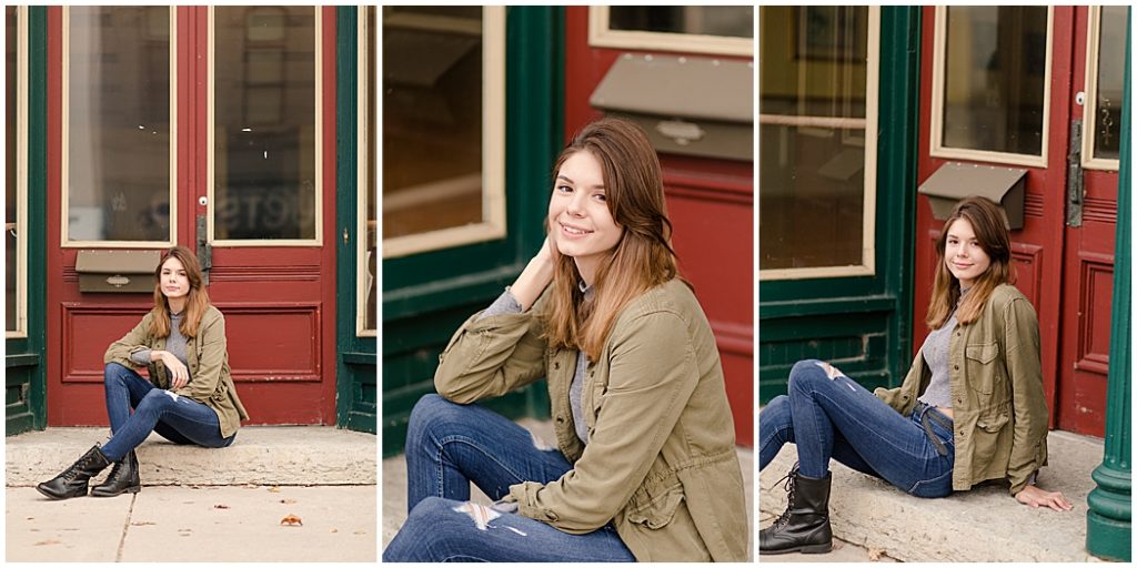 girl senior pictures in front of green building