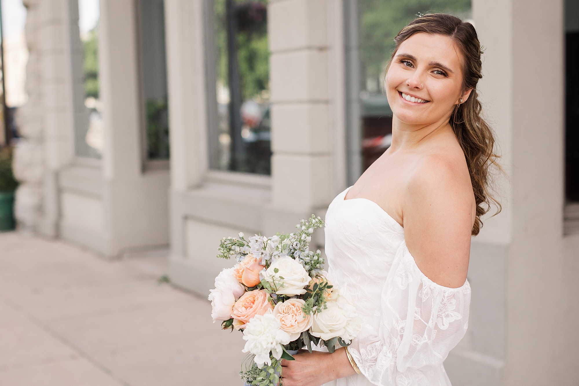 An Image of a smiling bride with glowing wedding day ready skin
